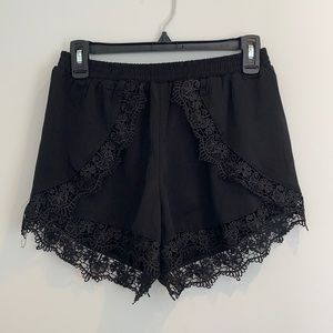 Shop Tobi black lace shorts